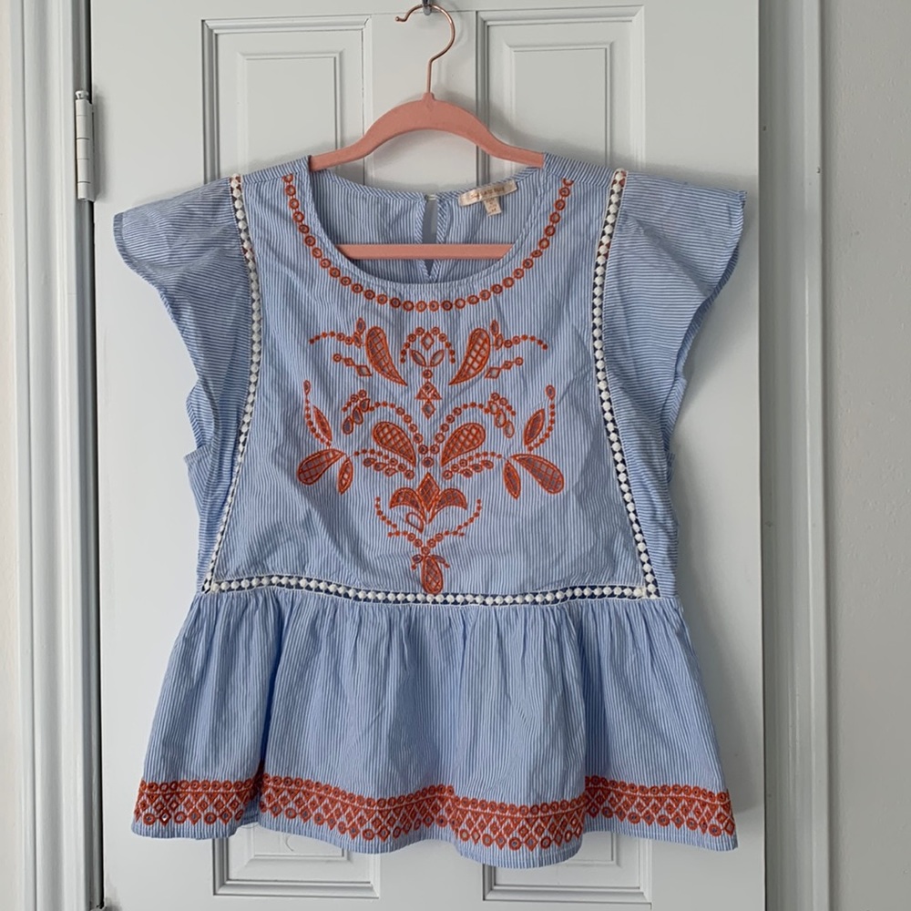 Skies are blue striped with embroidery peplum top